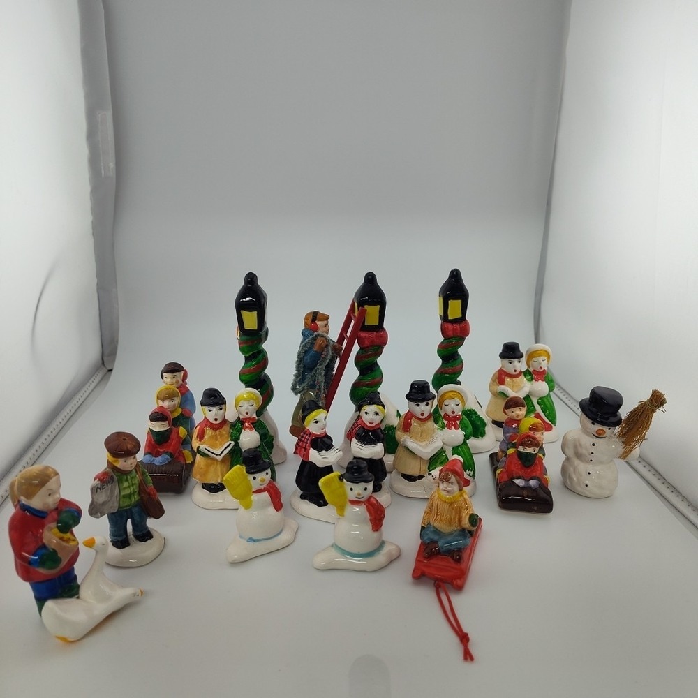 Christmas Village figurines carolers snowmen lampposts sledders ceramic people
